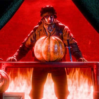 Call of War Halloween event featuring soldier in gas mask holding illuminated jack-o-lantern pumpkin with flames